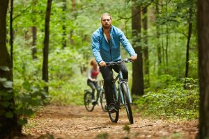 Cycling on forest path