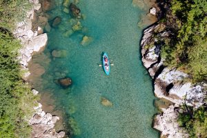 men canoeing in river